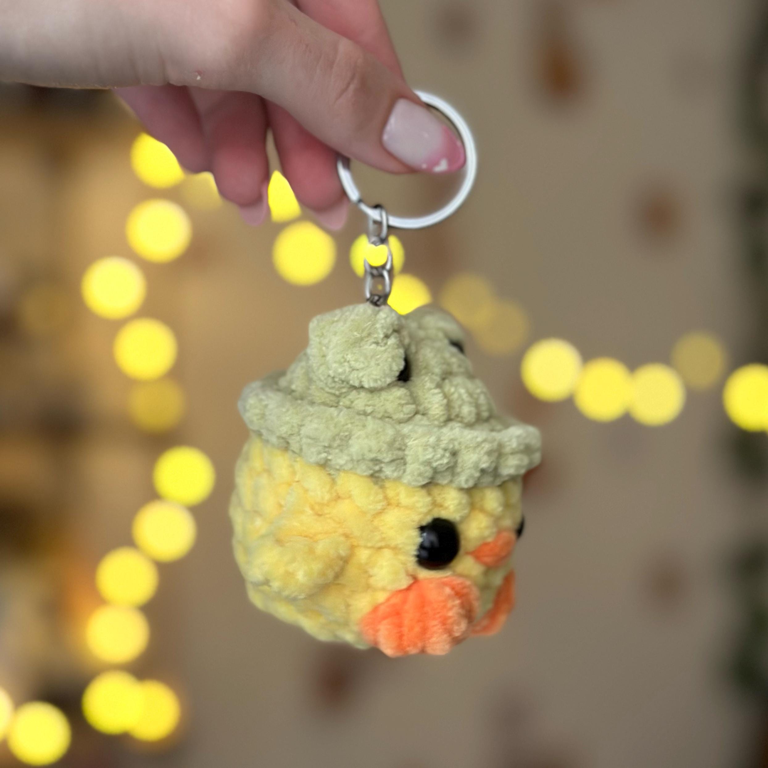 Mini duck in frog hat