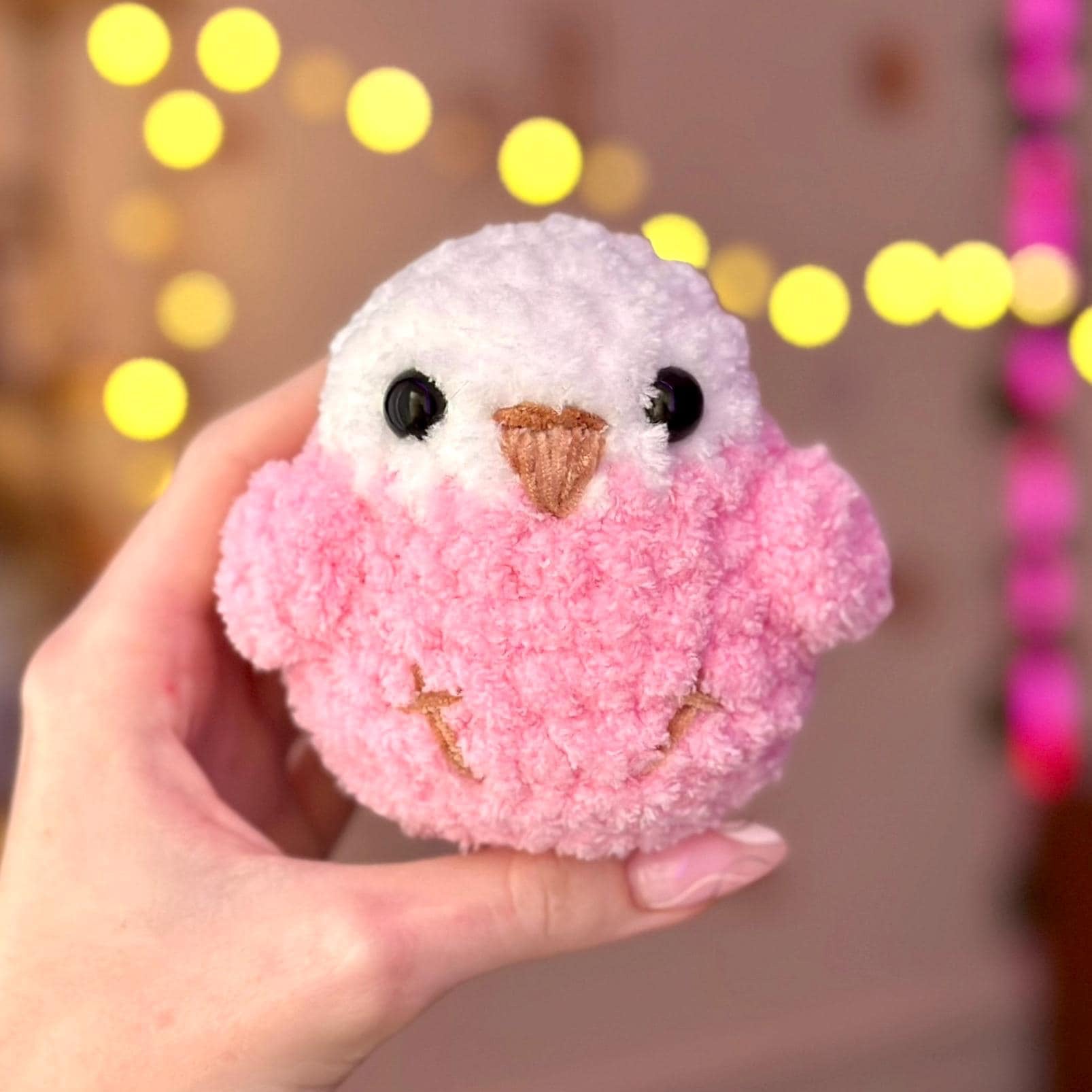 Pink fluffy bird