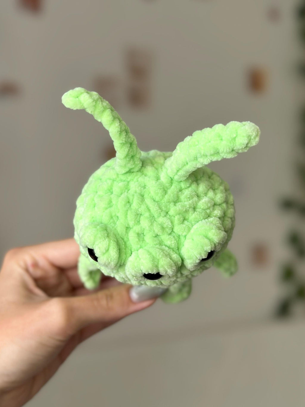 Three-eyed green alien