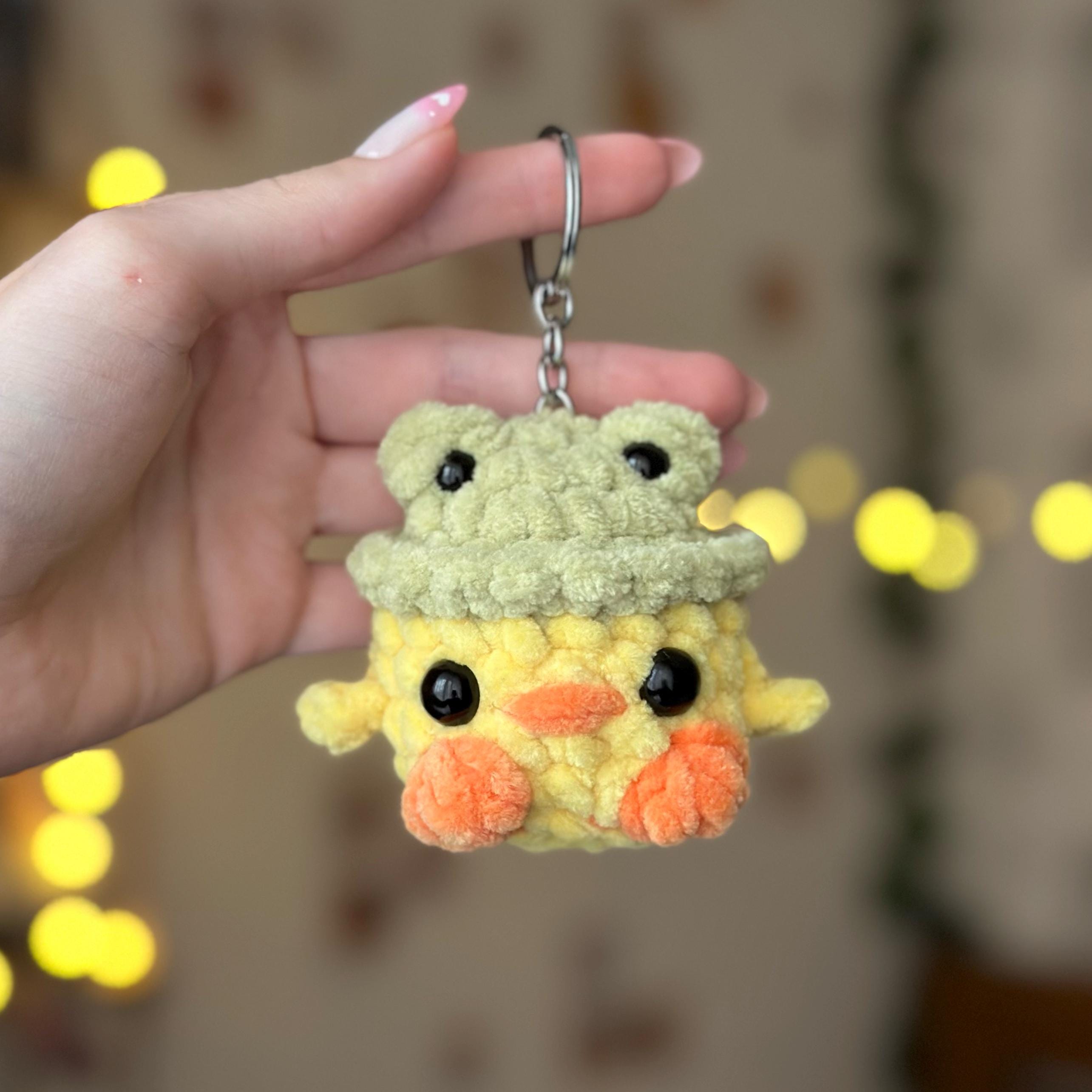 Mini duck in frog hat