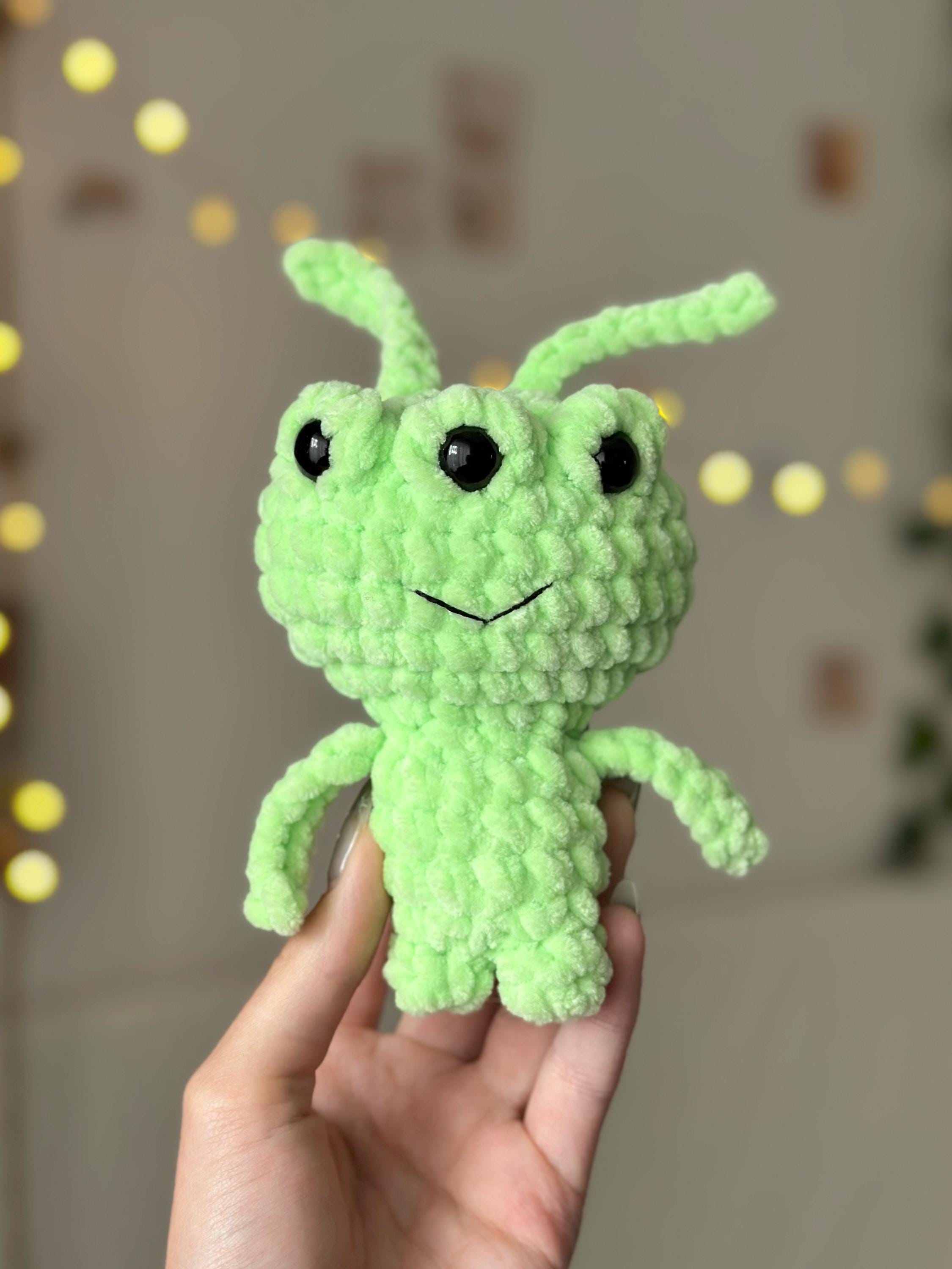 Three-eyed green alien