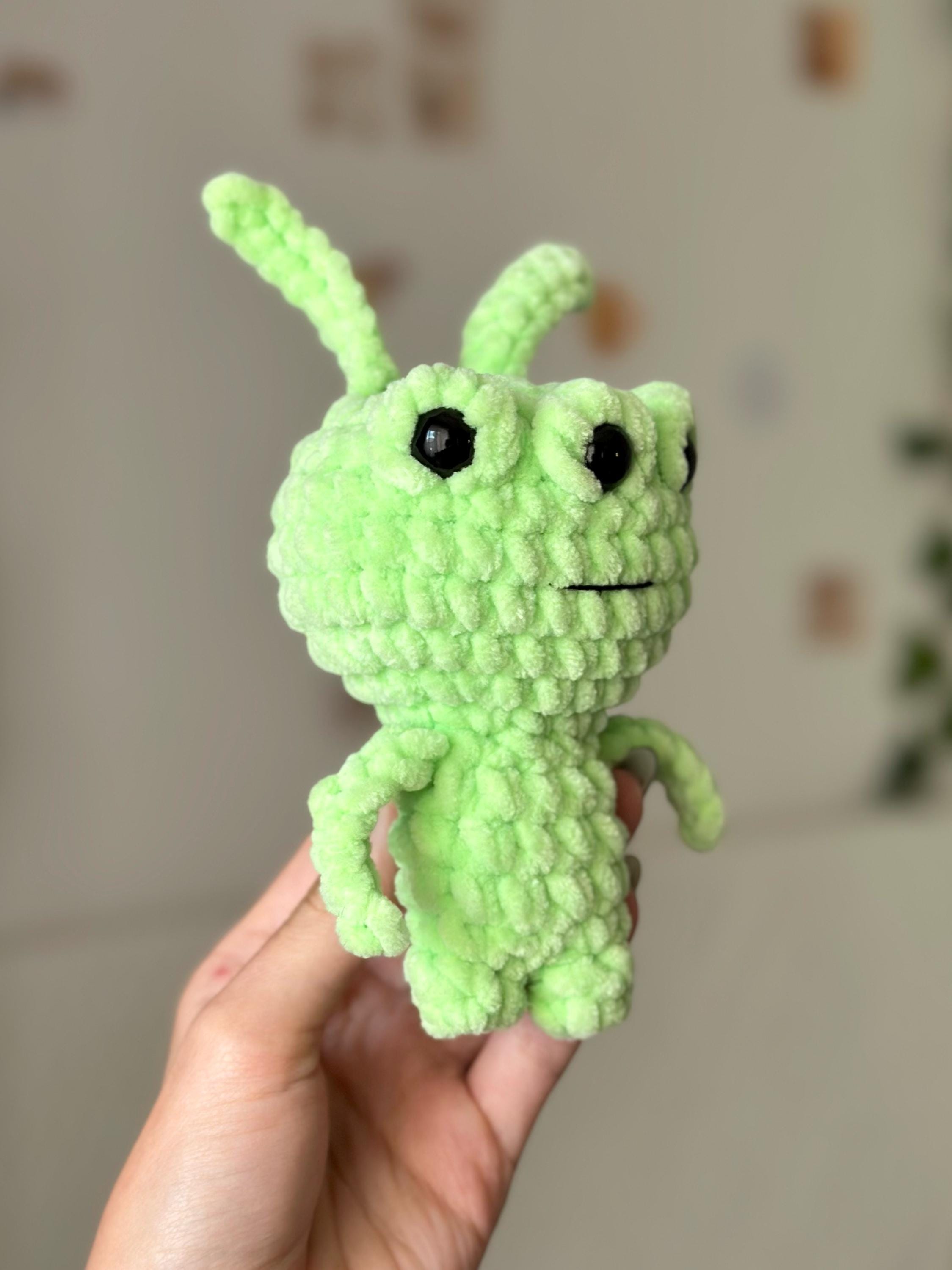 Three-eyed green alien