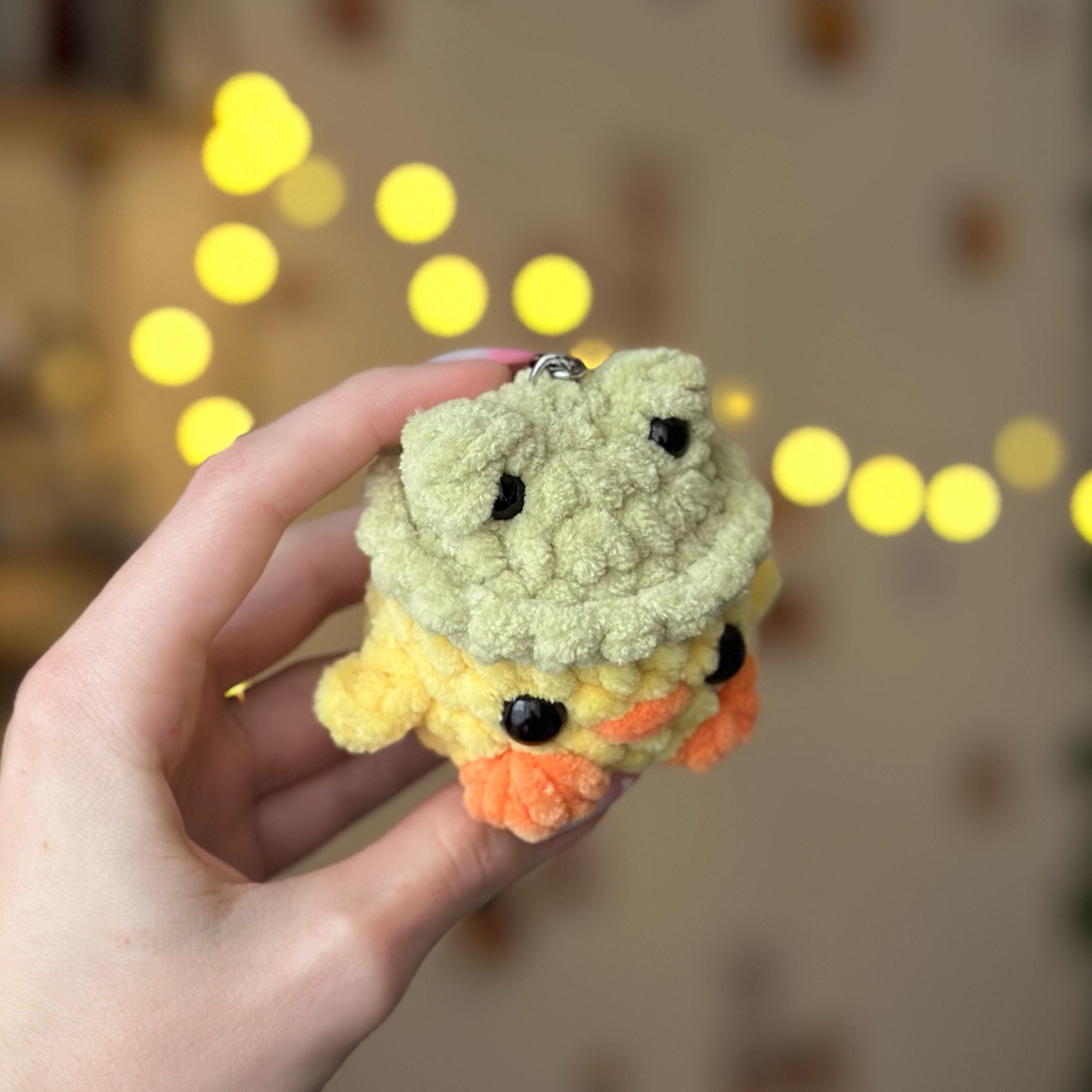 Mini duck in frog hat