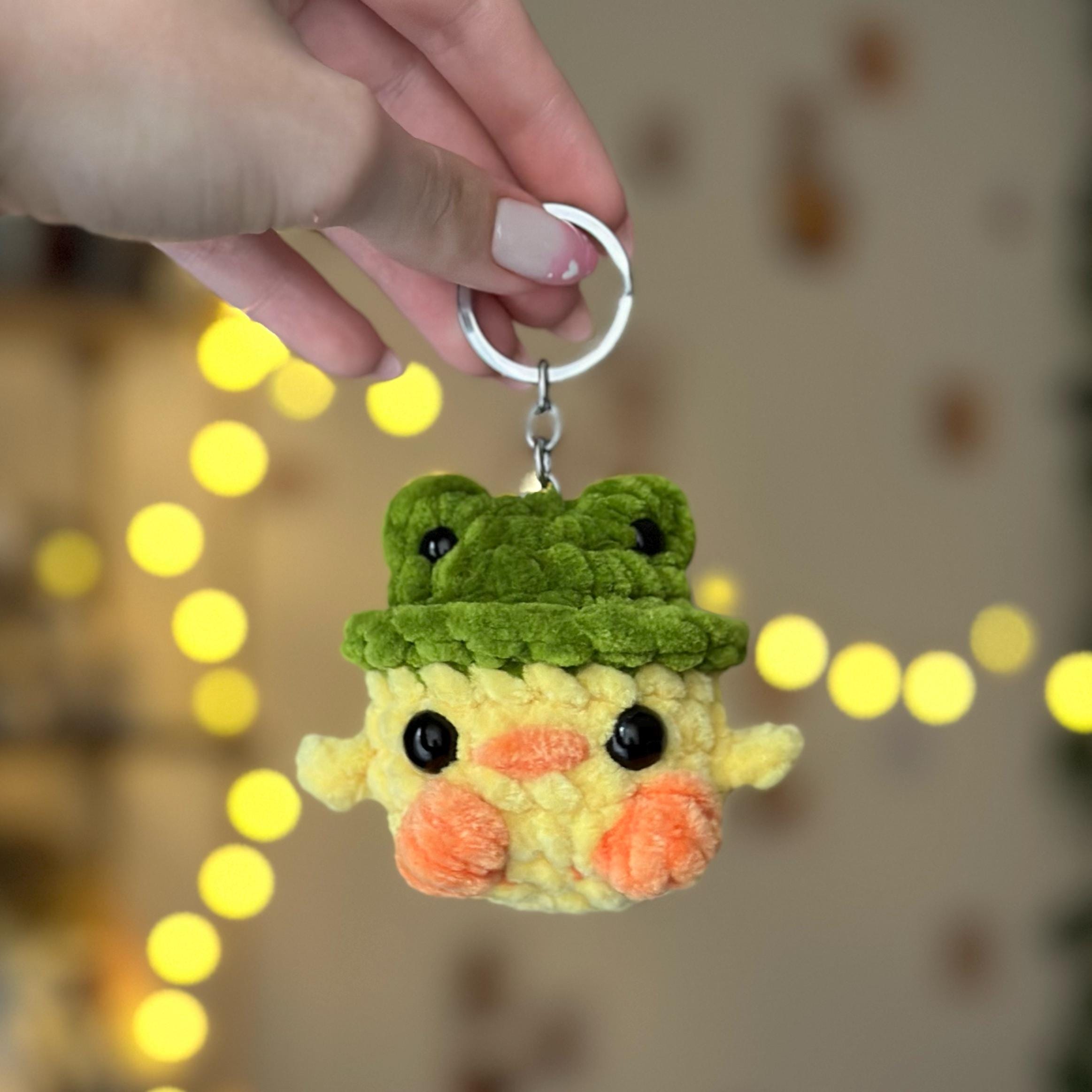 Mini duck in frog hat