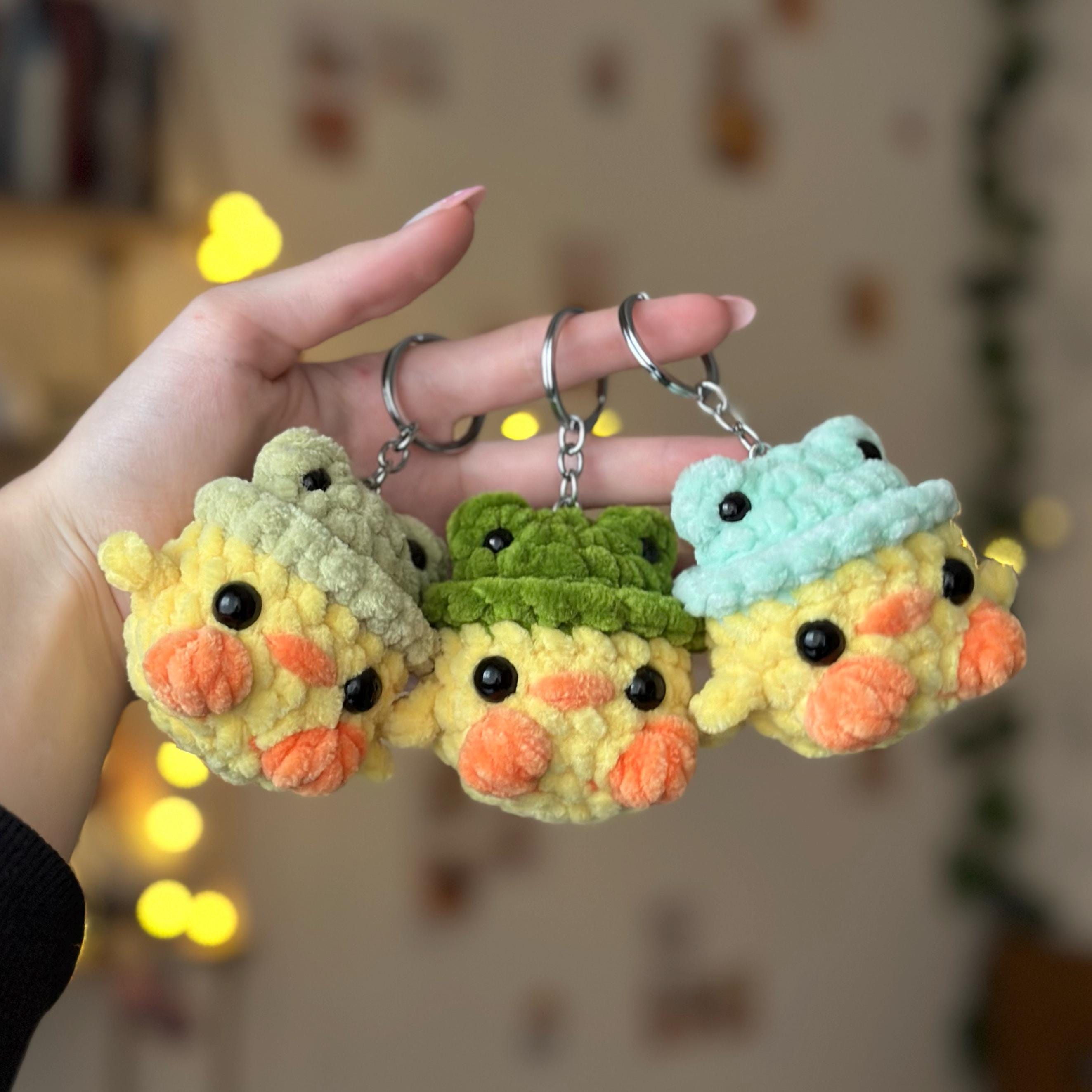 Mini duck in frog hat