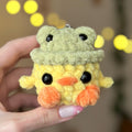 Mini duck in frog hat