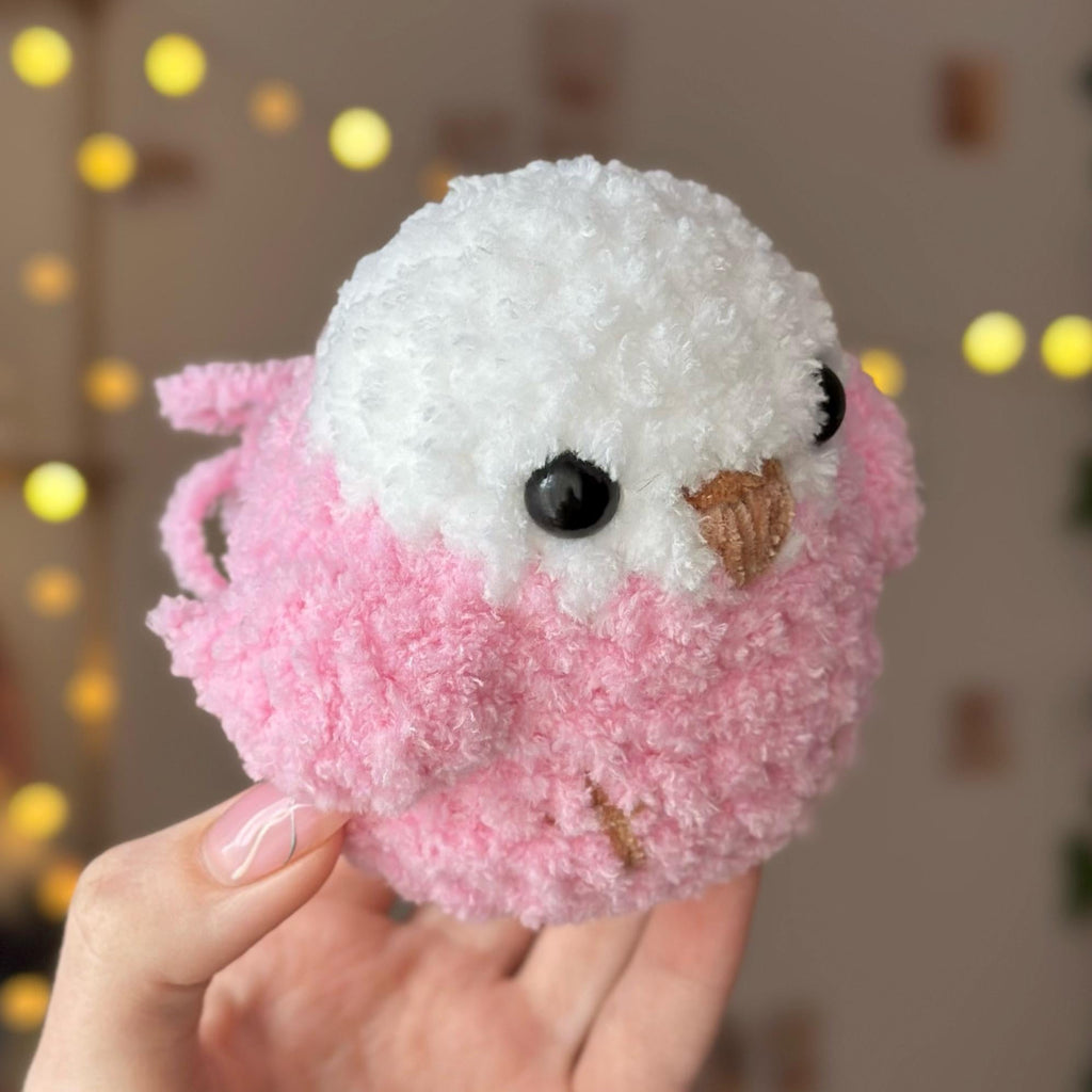 Pink fluffy bird