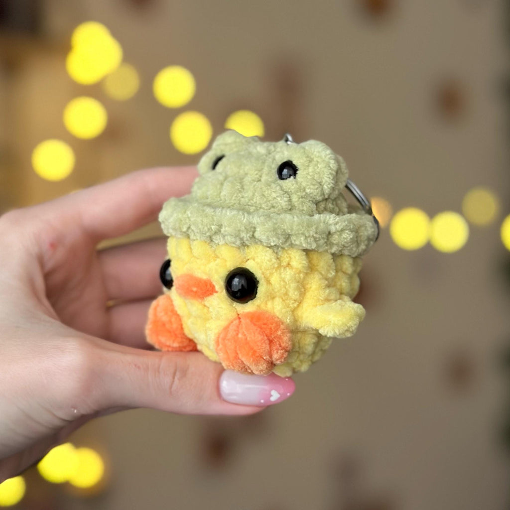 Mini duck in frog hat